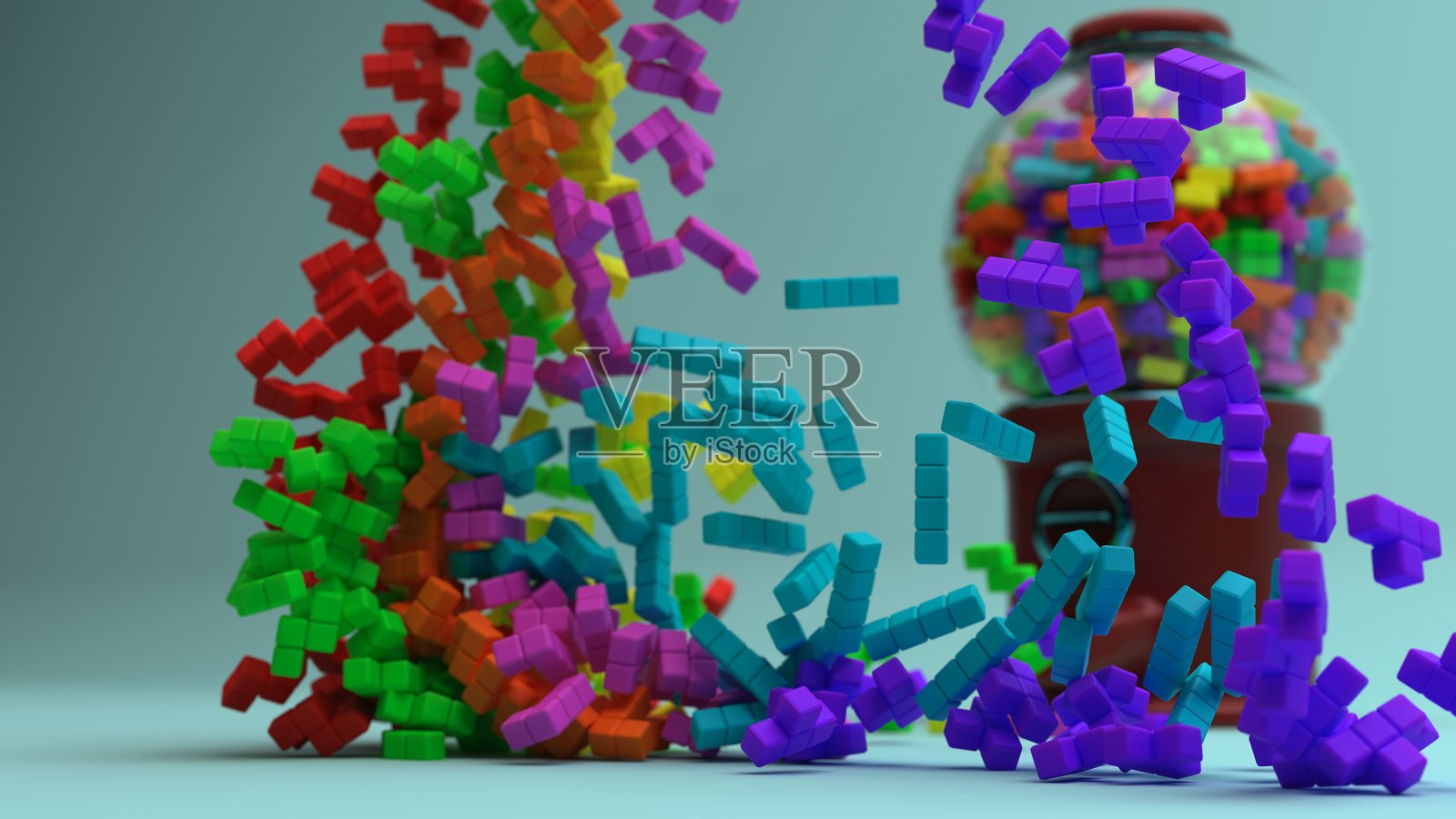 四个方块在一个装有方块的糖果机前方落下照片摄影图片