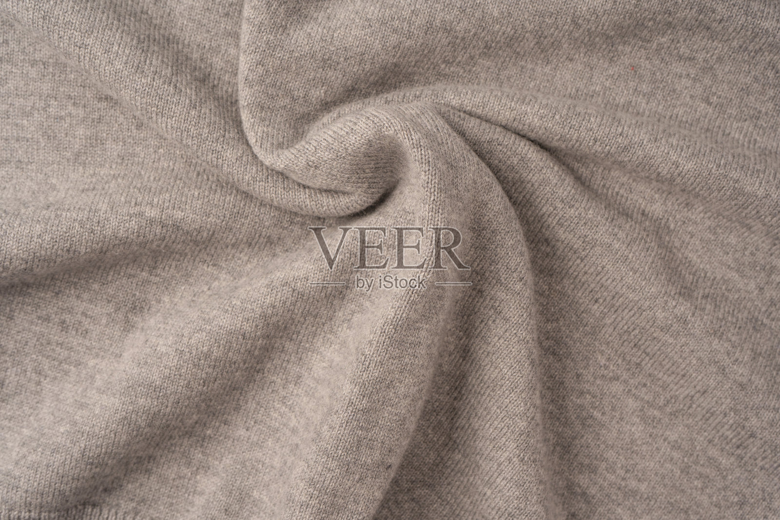 柔软的灰色美利奴羊毛毛衣纹理作为背景。照片摄影图片