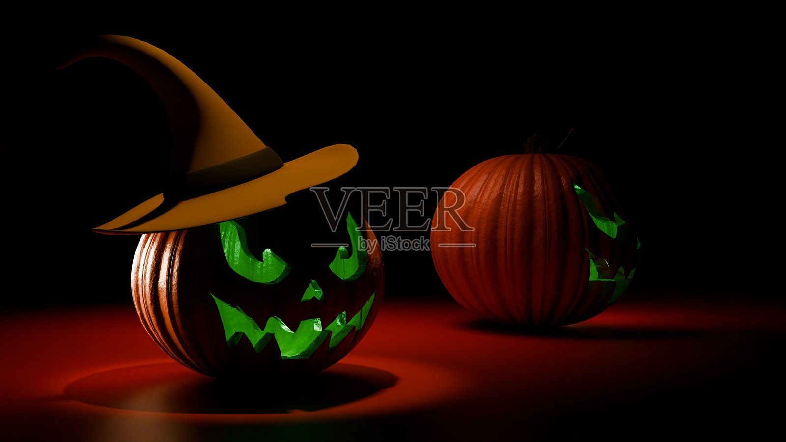 万圣节南瓜灯配有发光绿色女巫帽照片摄影图片