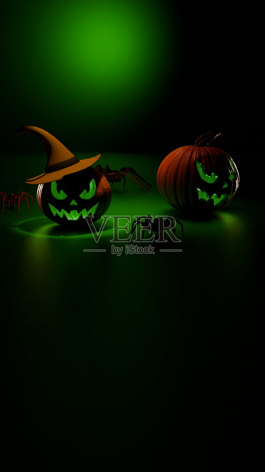 垂直发光的南瓜灯在绿色万圣节灯光下照片摄影图片