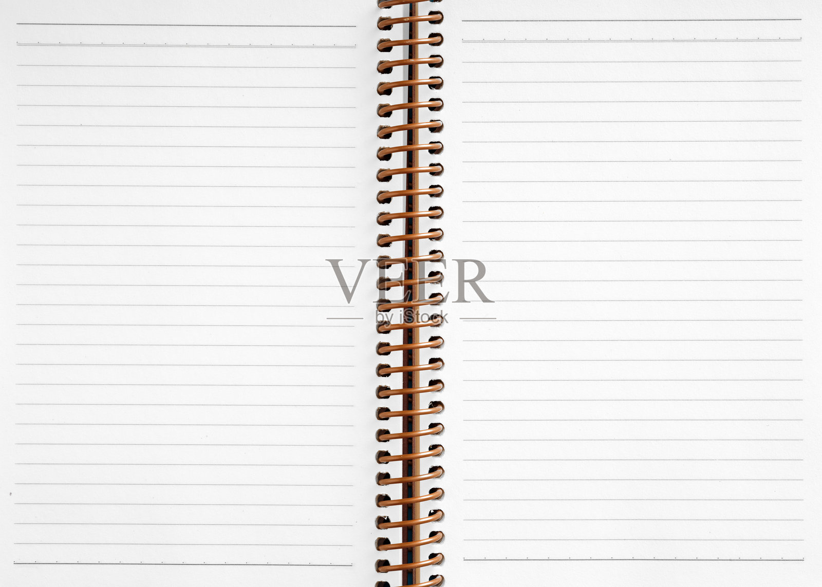 打开的螺旋笔记本，展示空白的横线页面照片摄影图片