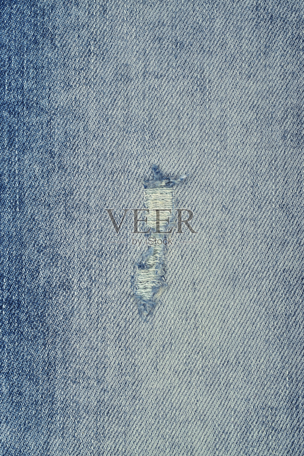 牛仔裤撕裂的俯视特写照片摄影图片