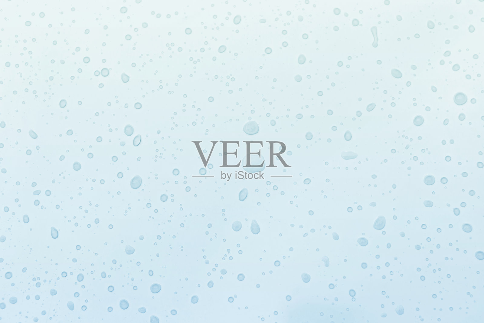 蓝色背景上的水滴照片摄影图片