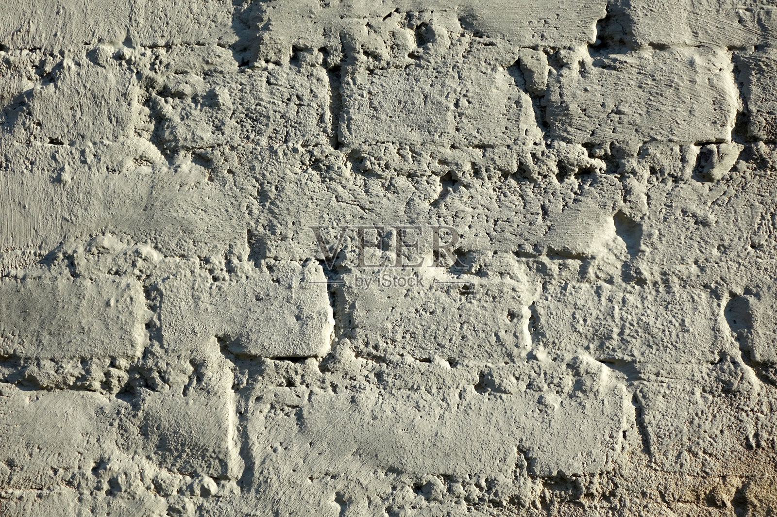 灰色抹灰覆盖的砖砌结构照片摄影图片