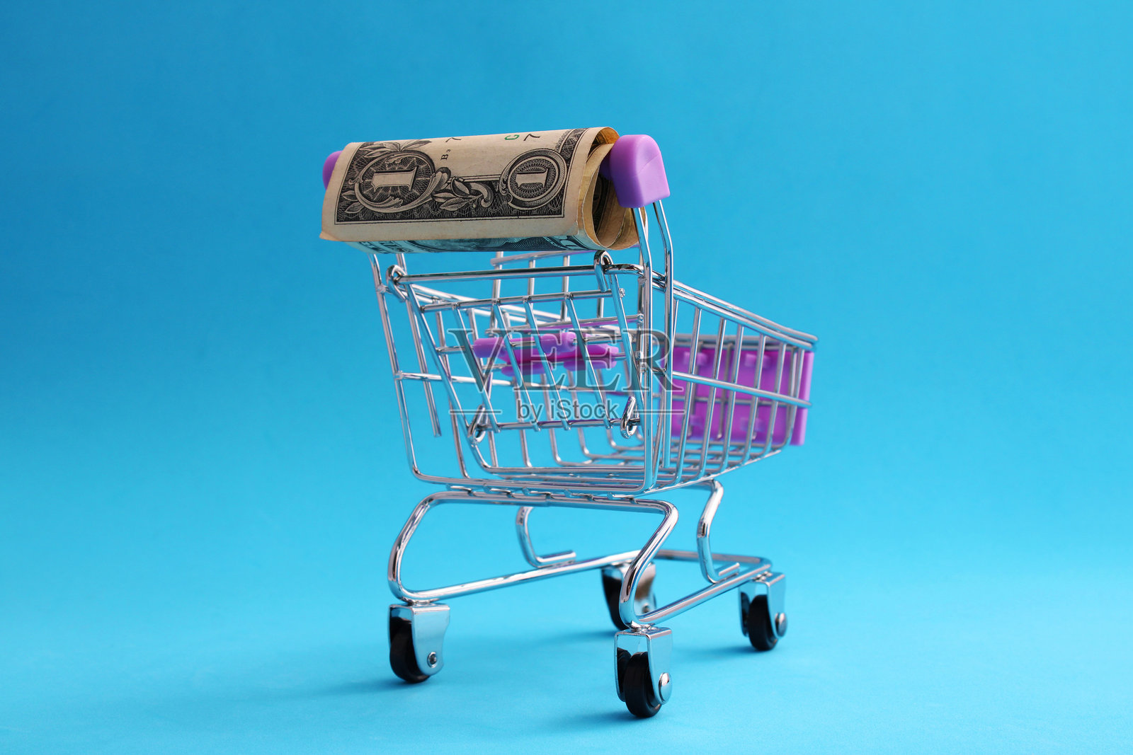 购物车把手上的美元照片摄影图片