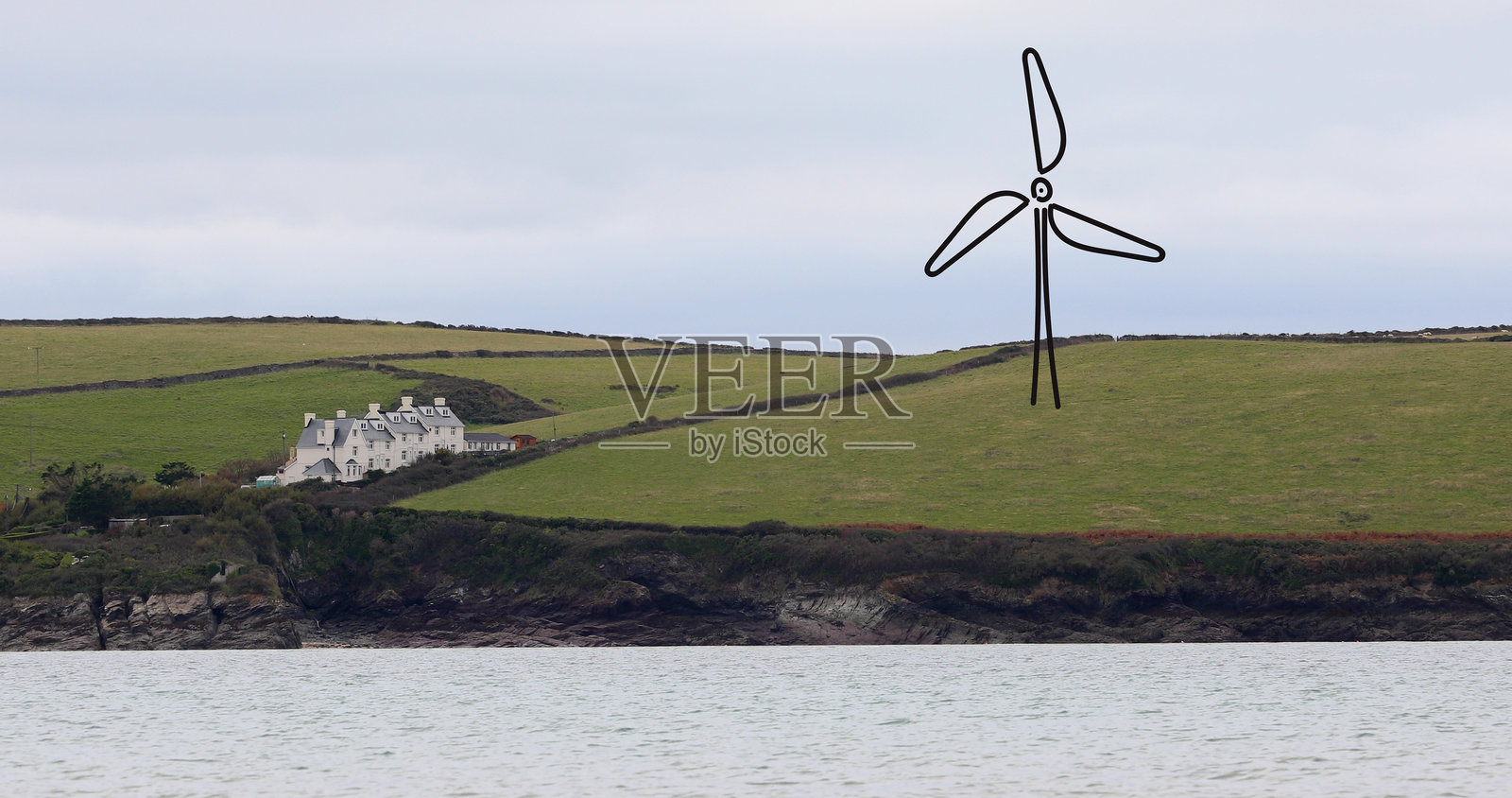 海边山坡上手绘风力涡轮机照片摄影图片