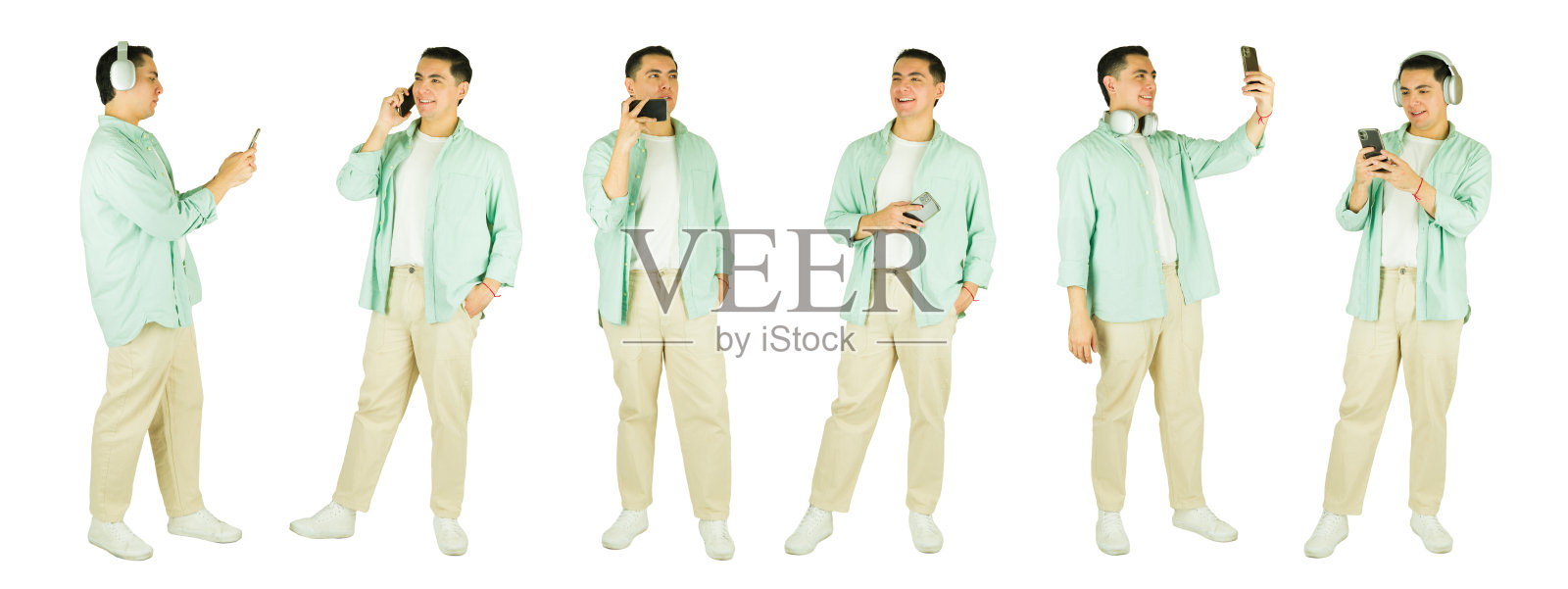 白底上，一名年轻男子正在使用智能手机进行各种活动照片摄影图片