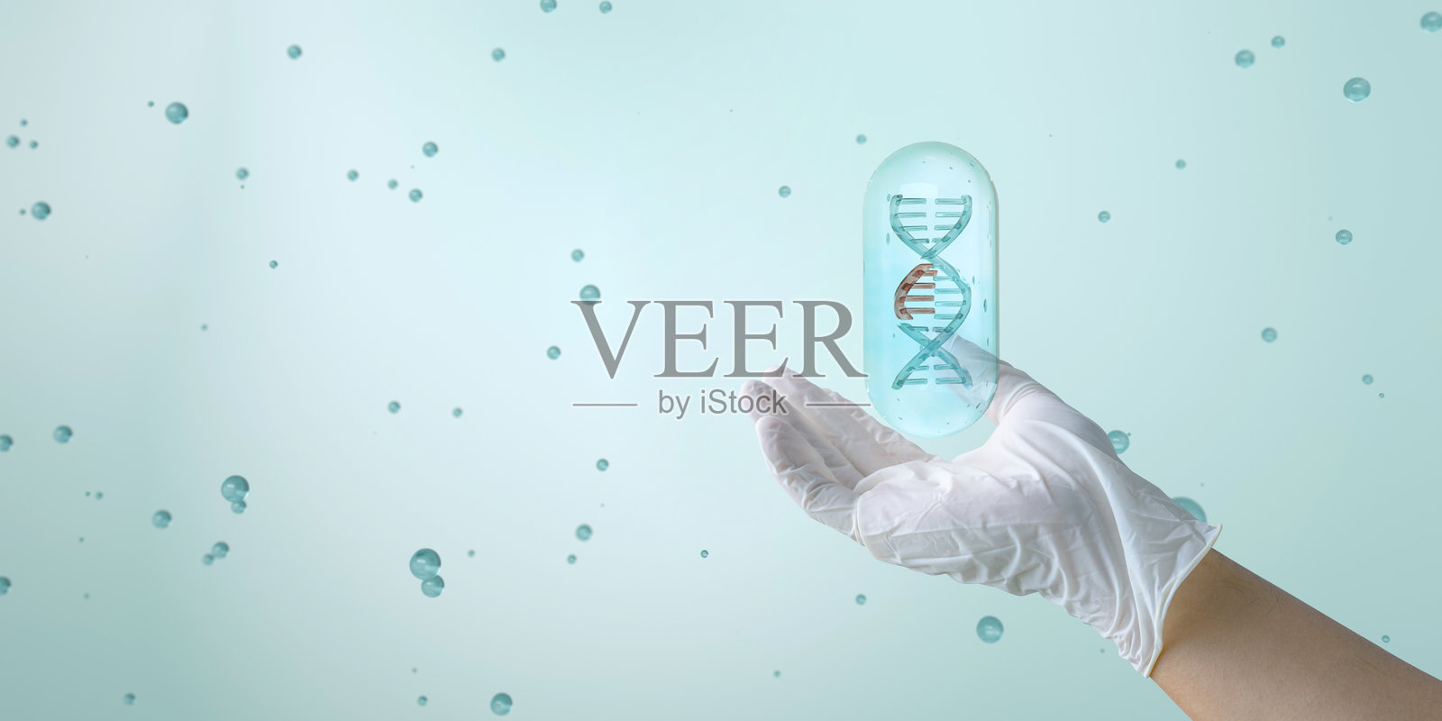 一只手展示着一段正在断裂的 DNA，象征着基因编辑的概念。创新的治疗遗传疾病的方法，基因医学。照片摄影图片