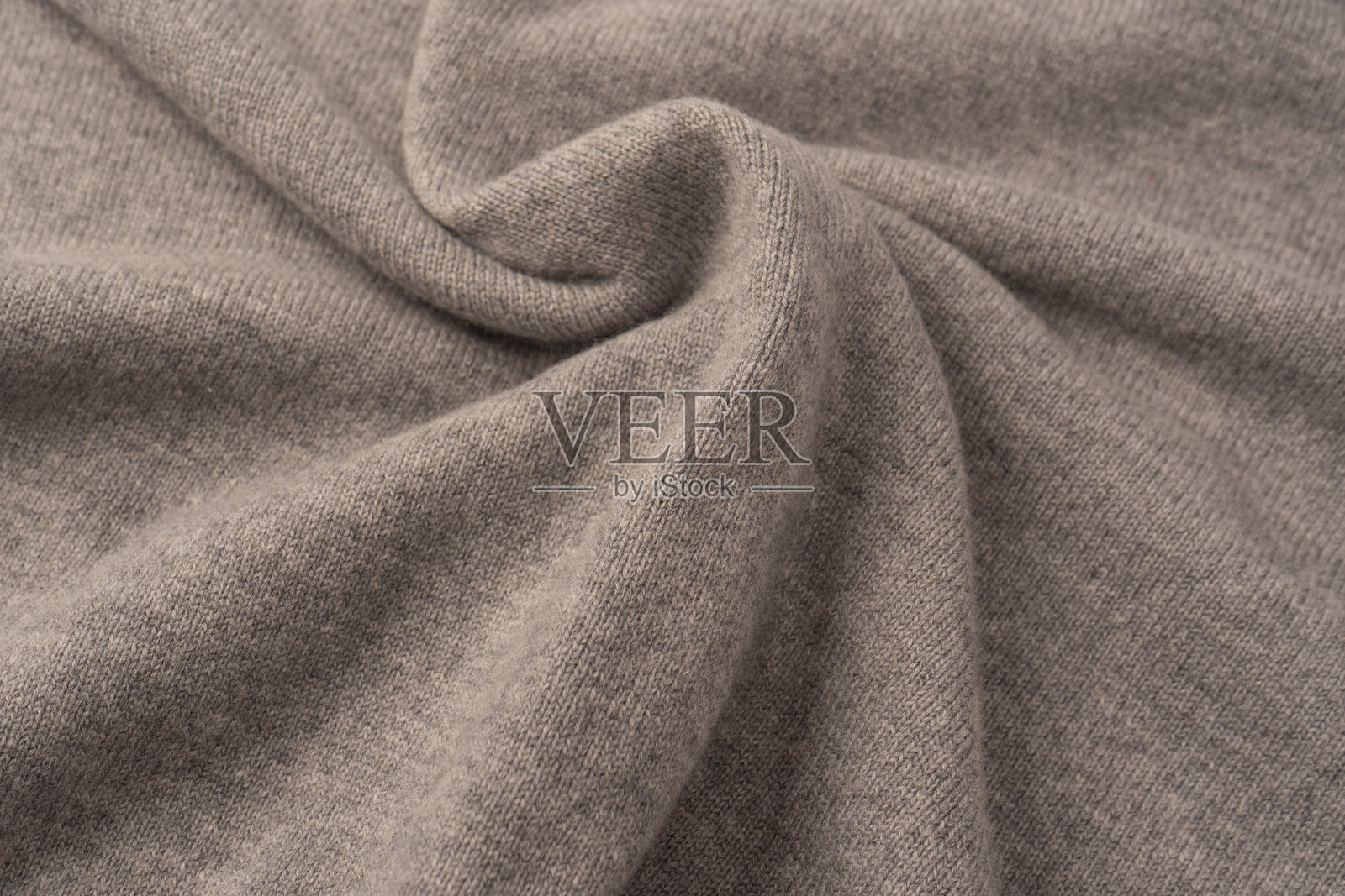 柔软的灰色美利奴羊毛毛衣纹理作为背景。照片摄影图片