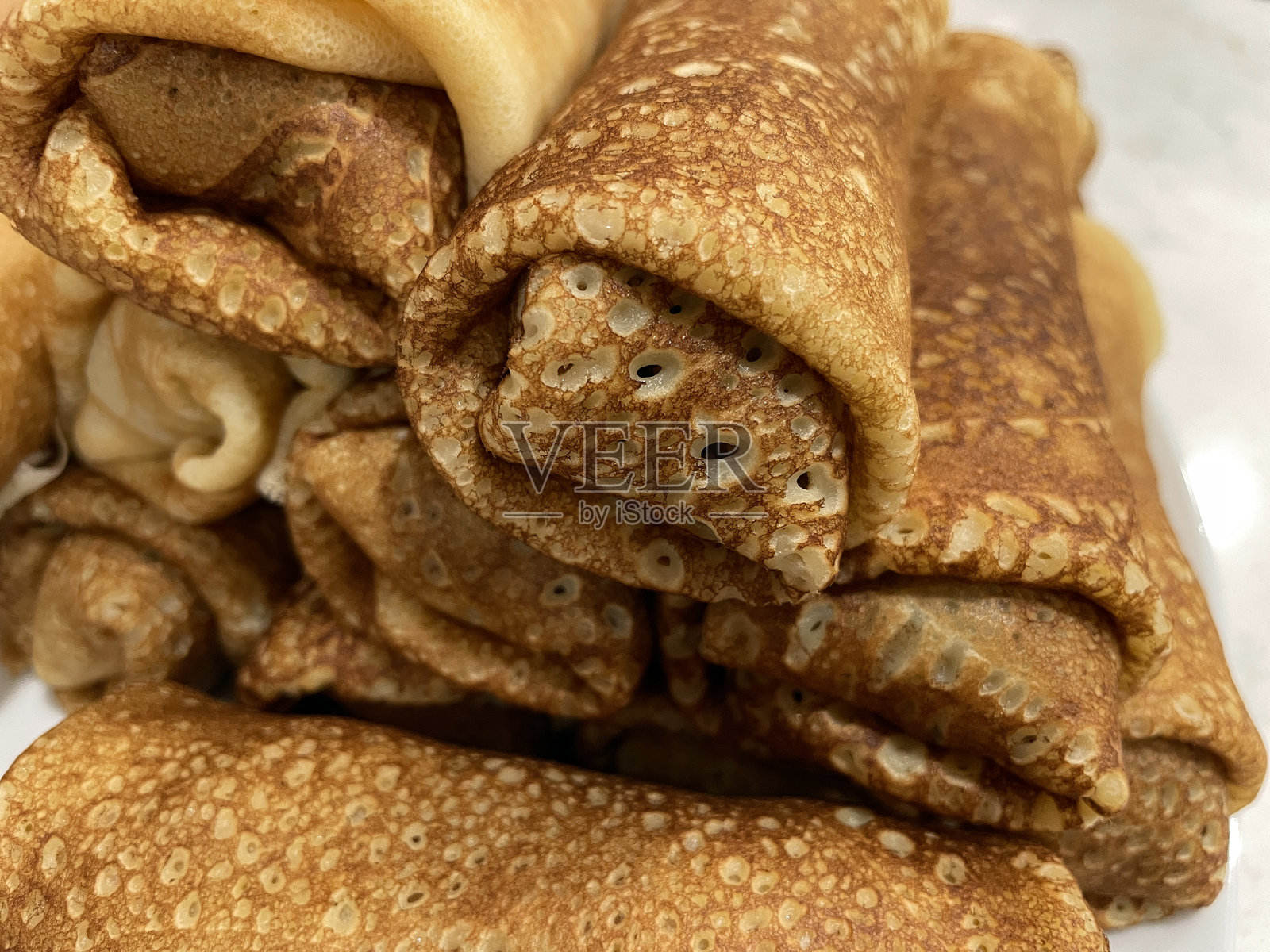 叠起来的卷饼，用于自制早餐甜点照片摄影图片