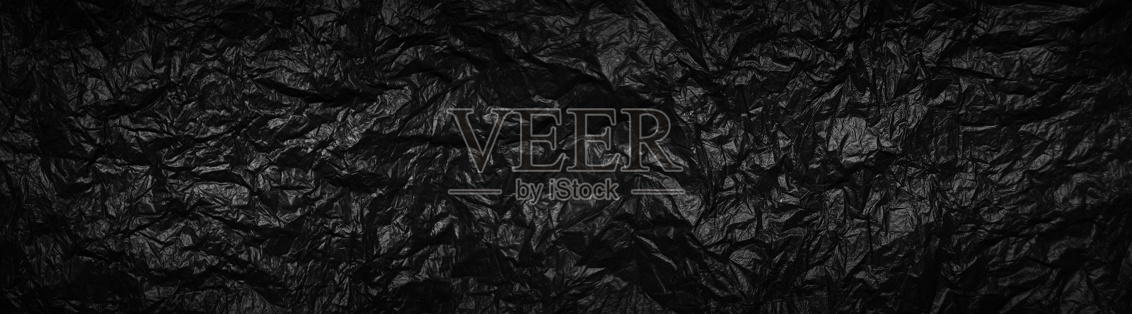 黑色垃圾袋纹理背景，留有复制空间照片摄影图片