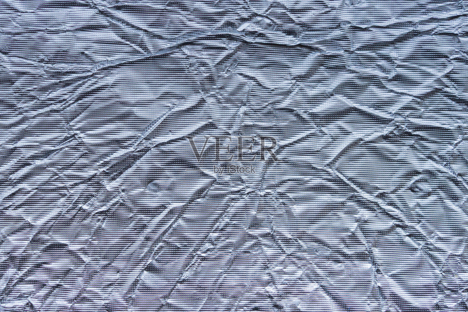 闪亮的金属银灰色箔纸揉皱的纹理背景照片摄影图片