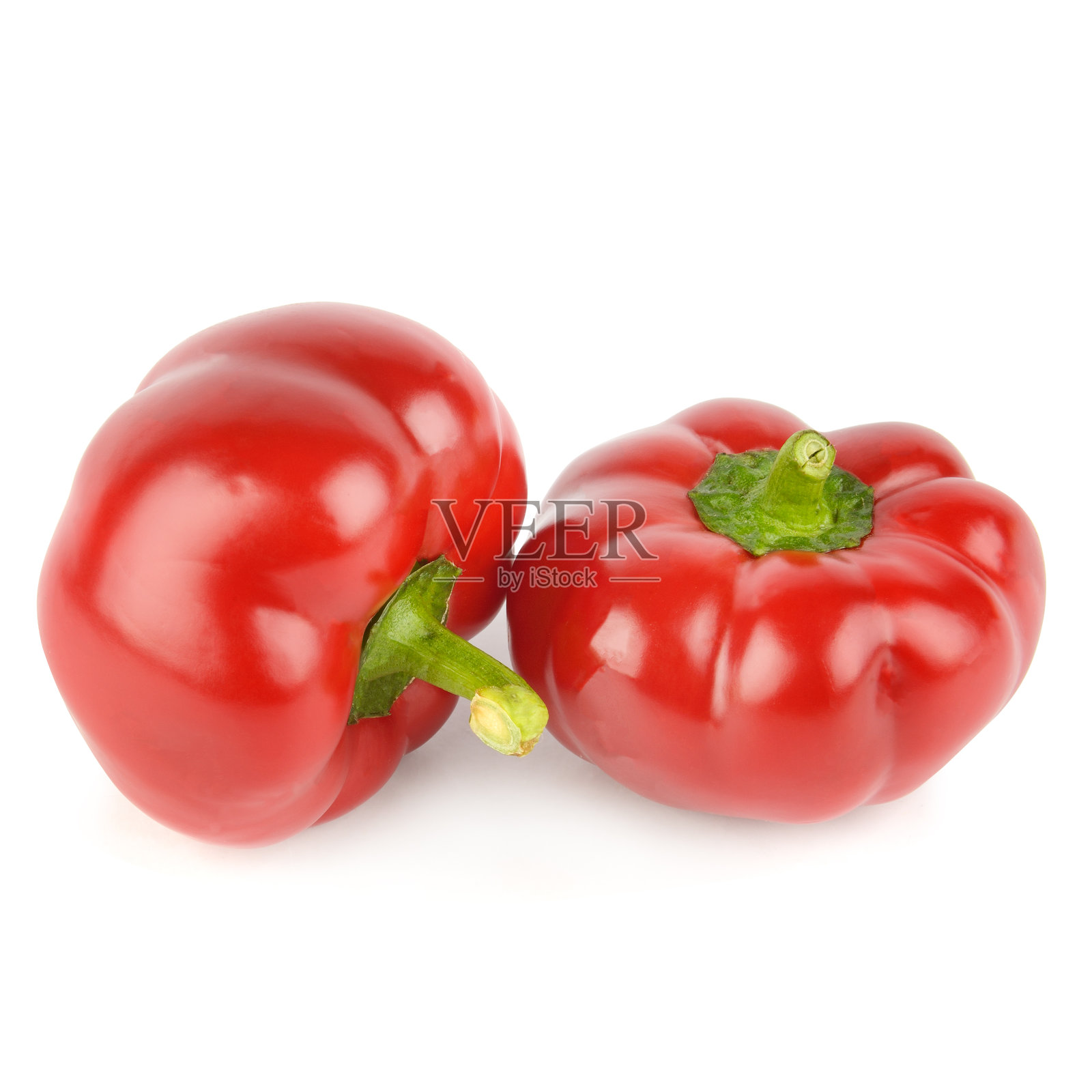 白色背景上两个成熟的红色圆形辣椒照片摄影图片