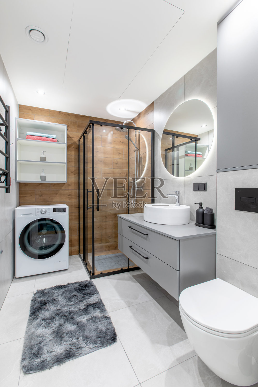 现代家居浴室设计，配有淋浴、洗衣机和当代家具照片摄影图片