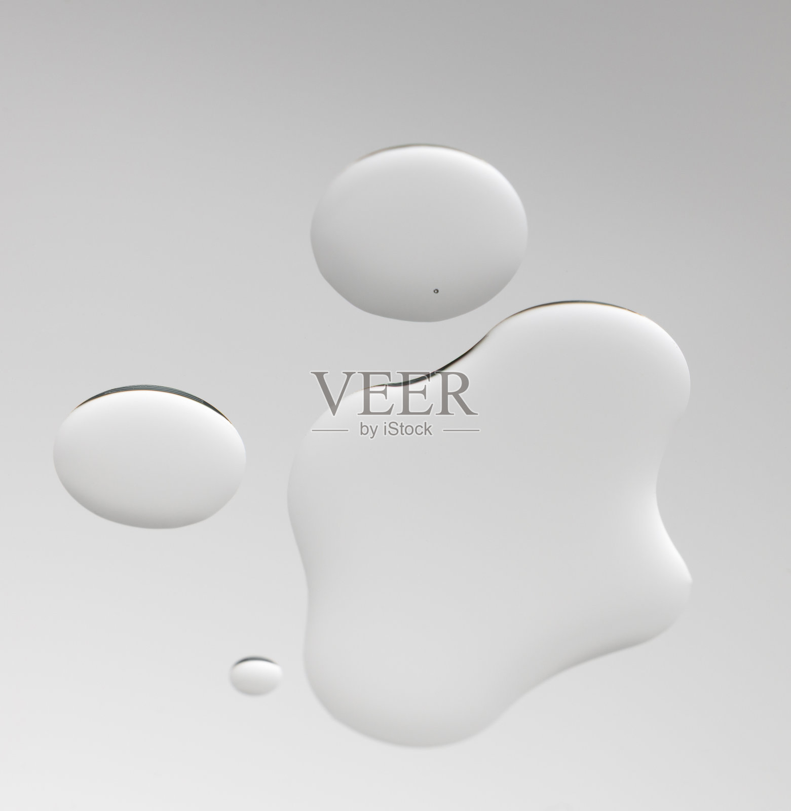 透明精油滴，化妆品质地，护肤品污迹，面部精华，精油，洁面乳，发油照片摄影图片