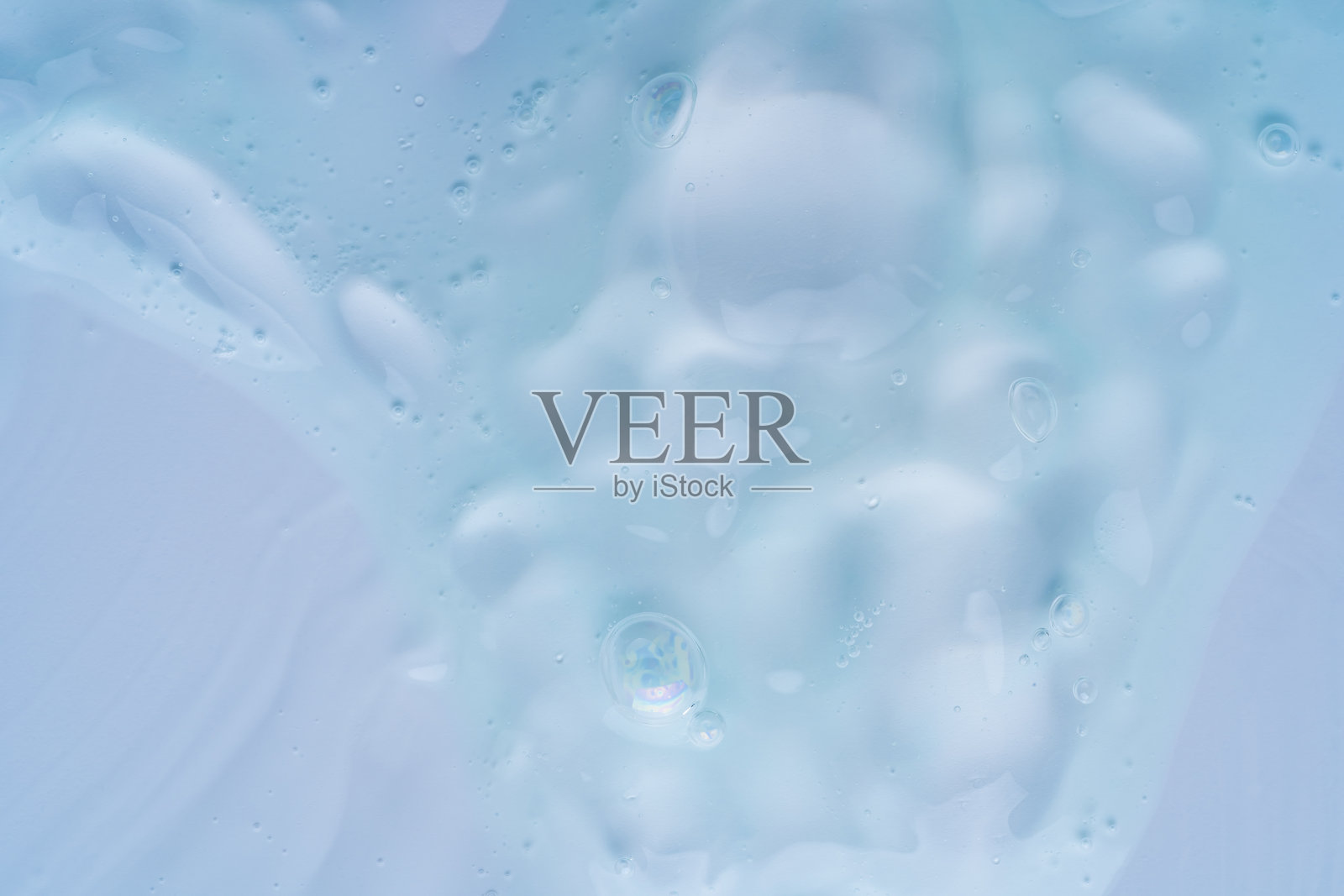 抽象蓝色液体纹理，带有柔和的气泡照片摄影图片