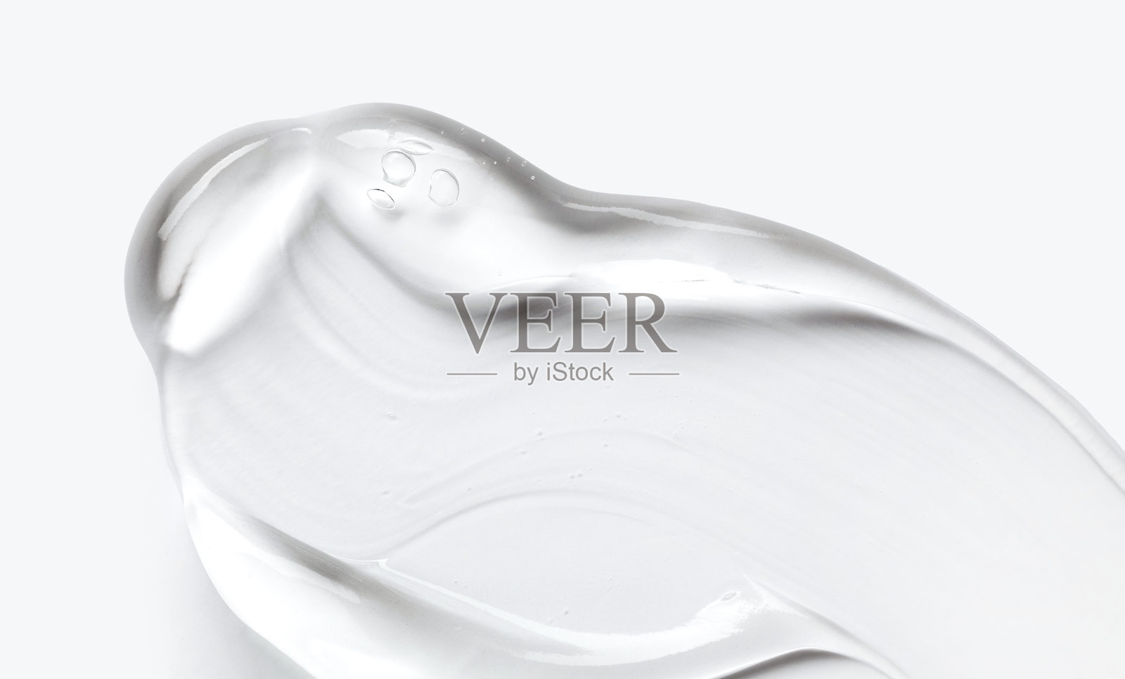 浅色背景上奶油凝胶质地的化妆品涂抹特写照片摄影图片