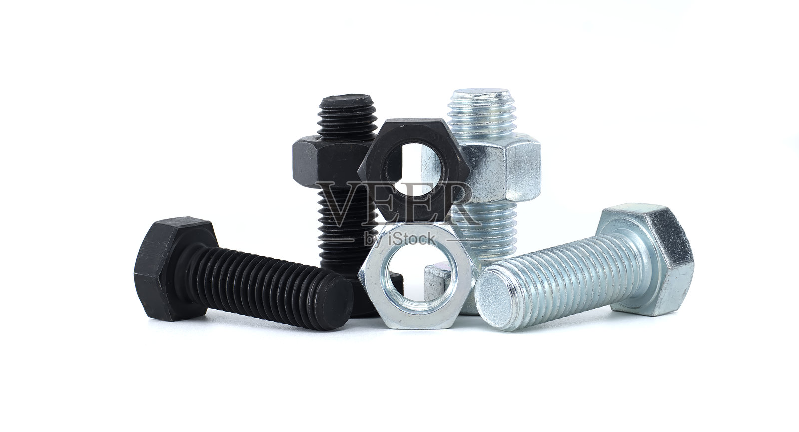 白色背景上的各种工业螺丝和螺母照片摄影图片