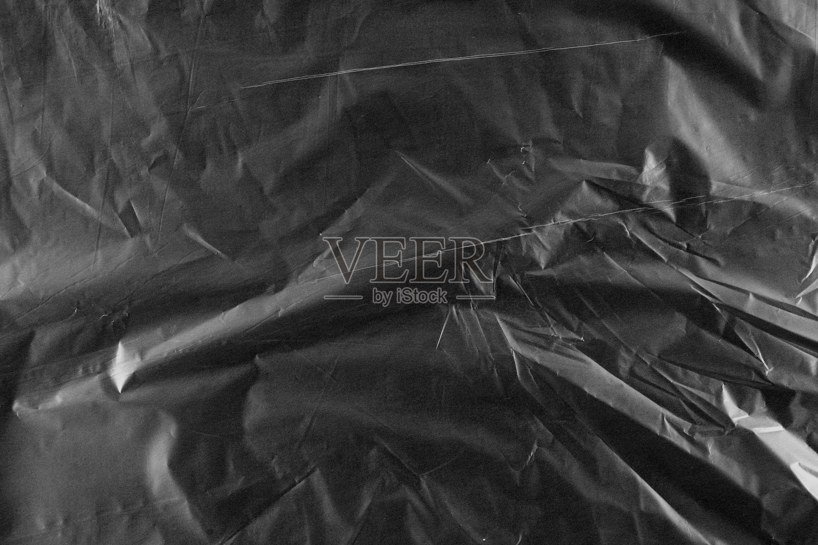 黑色皱褶纹理玻璃纸背景照片摄影图片
