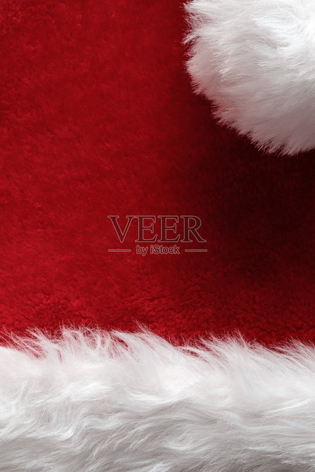 圣诞老人帽仿毛皮纹理特写。红色和白色的圣诞背景。照片摄影图片