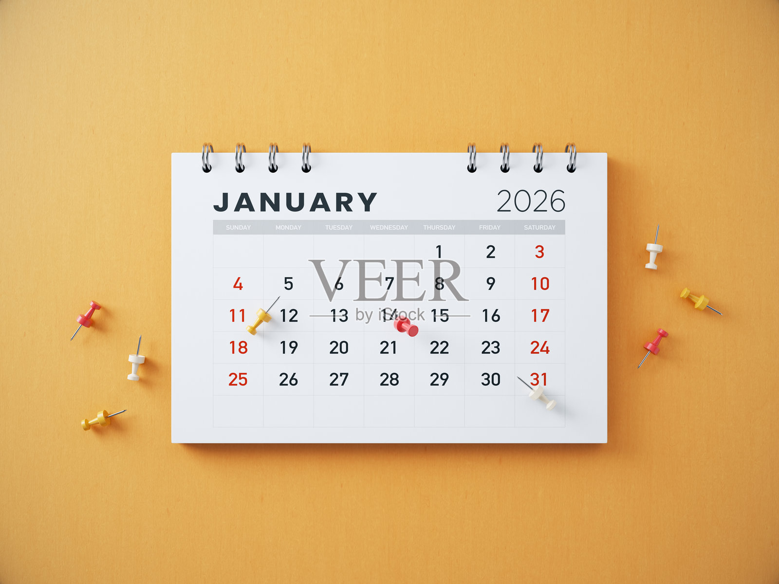 2026年1月日历和图钉在橙色背景上照片摄影图片