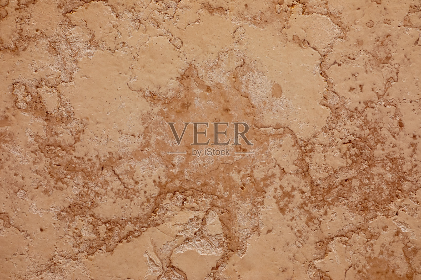 奶油米色和棕色表面的抽象特写，具有大理石般的纹理和触感粗糙的质感。非常适合用作背景、平面设计和建筑项目。照片摄影图片