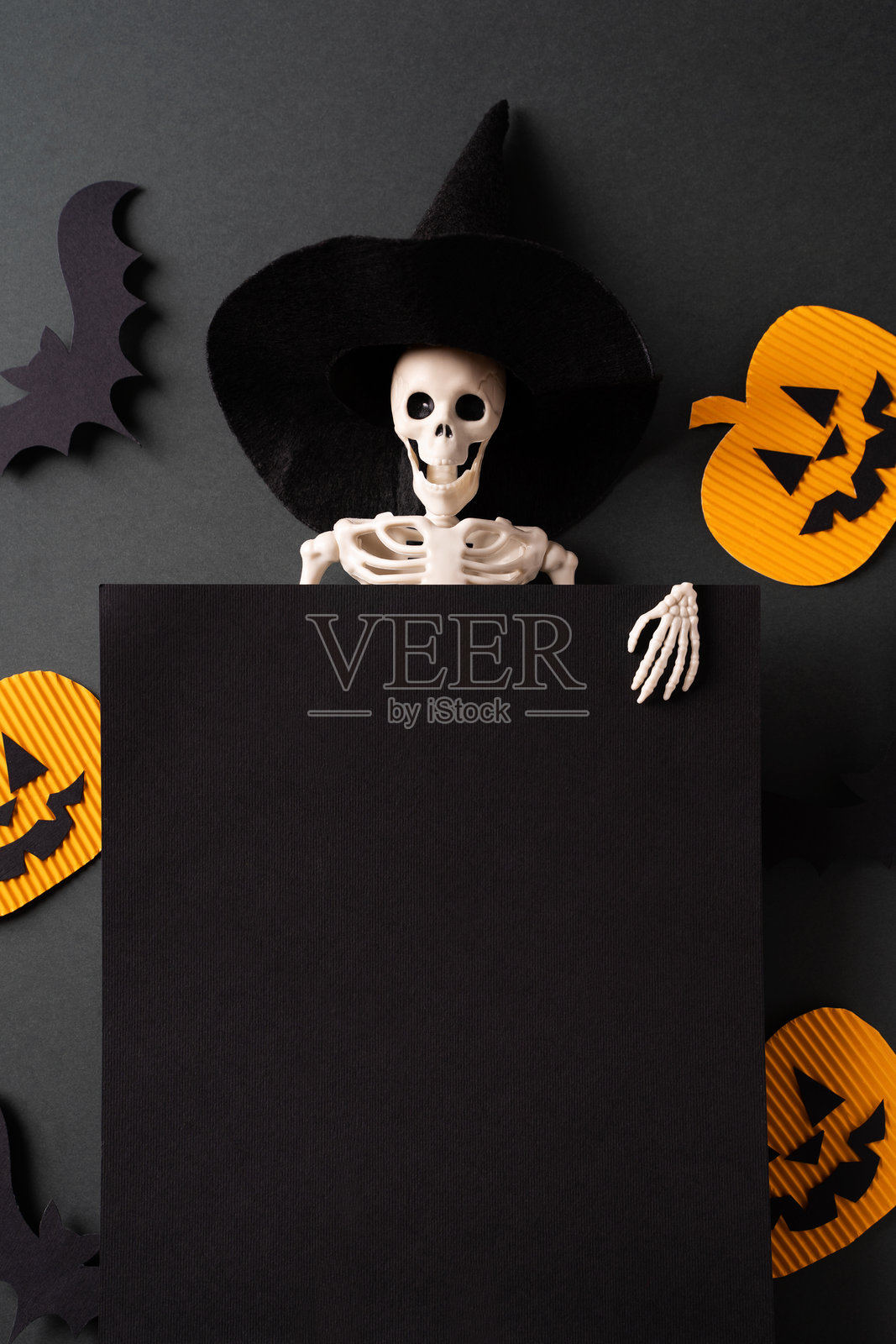 万圣节骷髅戴巫师帽与南瓜照片摄影图片