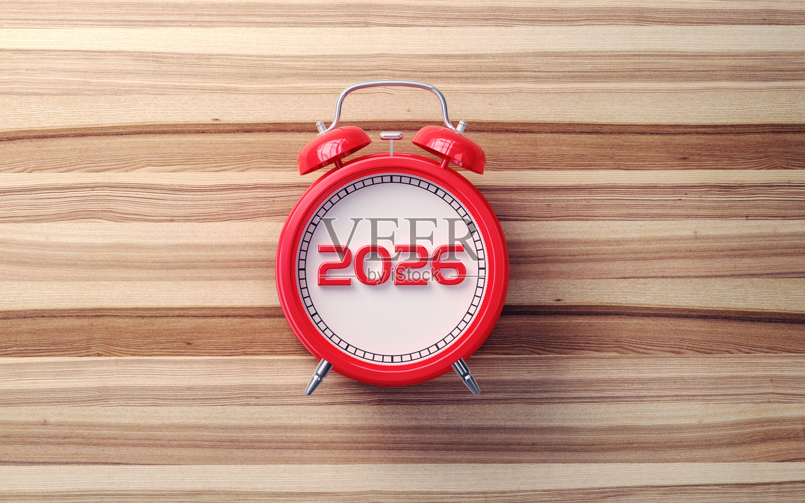 带有“新年2026”字样的红色闹钟，座子为木质照片摄影图片