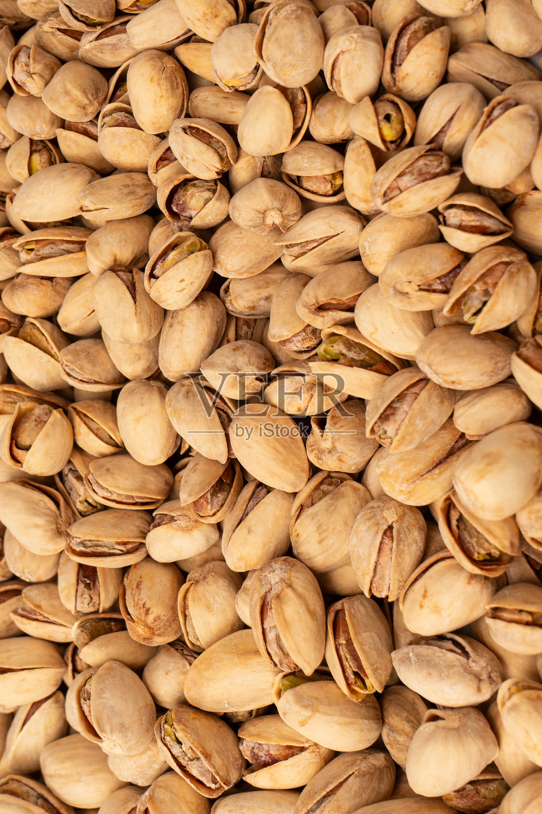 美味的开心果，孤立在白色背景上。照片摄影图片