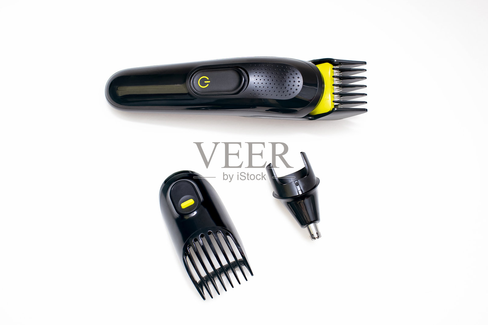 剃刀修剪器用于理发，以及各种配套喷嘴，放置在白色背景上照片摄影图片