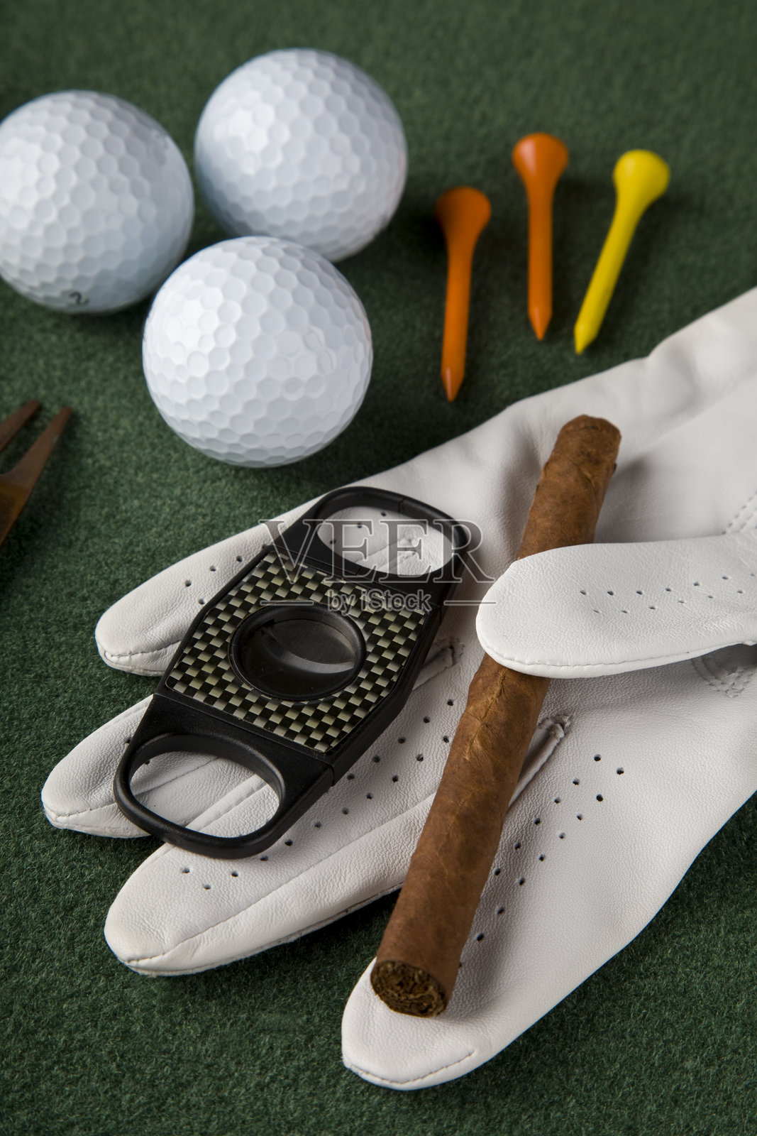 高尔夫手套、雪茄剪、高尔夫球钉照片摄影图片
