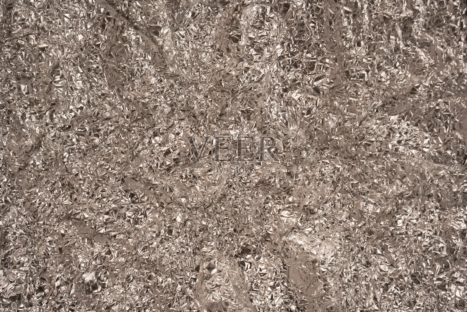 闪亮的银色箔纸背景。俯视视角。照片摄影图片