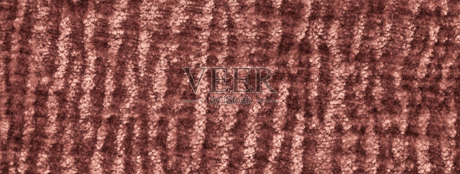 温暖的棕色柔软天鹅绒织物纹理背景。闪亮的铜色毛绒纺织表面，绒毛蓬松的宏观背景。照片摄影图片