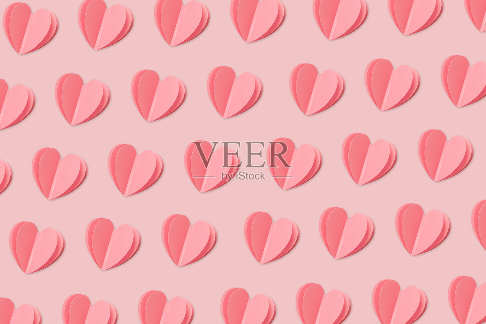 粉色心形图案，重复的心形柔和阴影，现代简约粉色心形背景设计，时尚简约的粉彩粉色爱情象征，用于节日情人节设计壁纸的平面印刷照片摄影图片