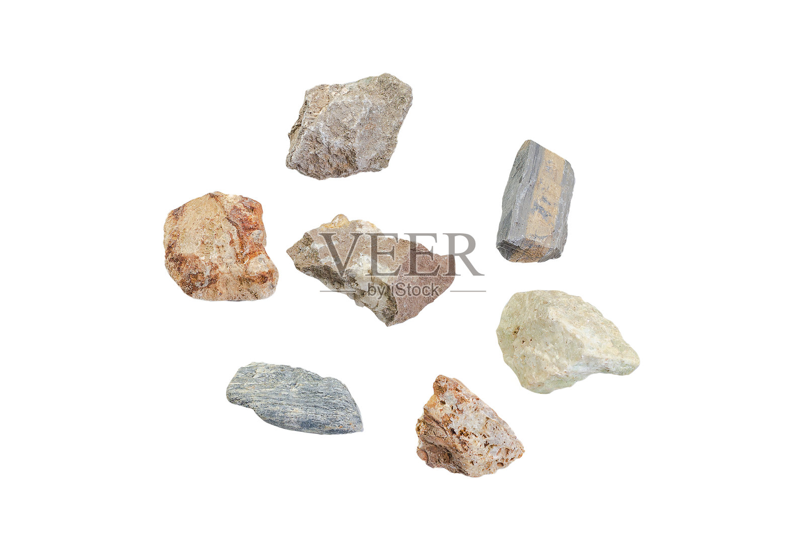 七块粗糙的天然石块在白色背景上排列成圆形照片摄影图片
