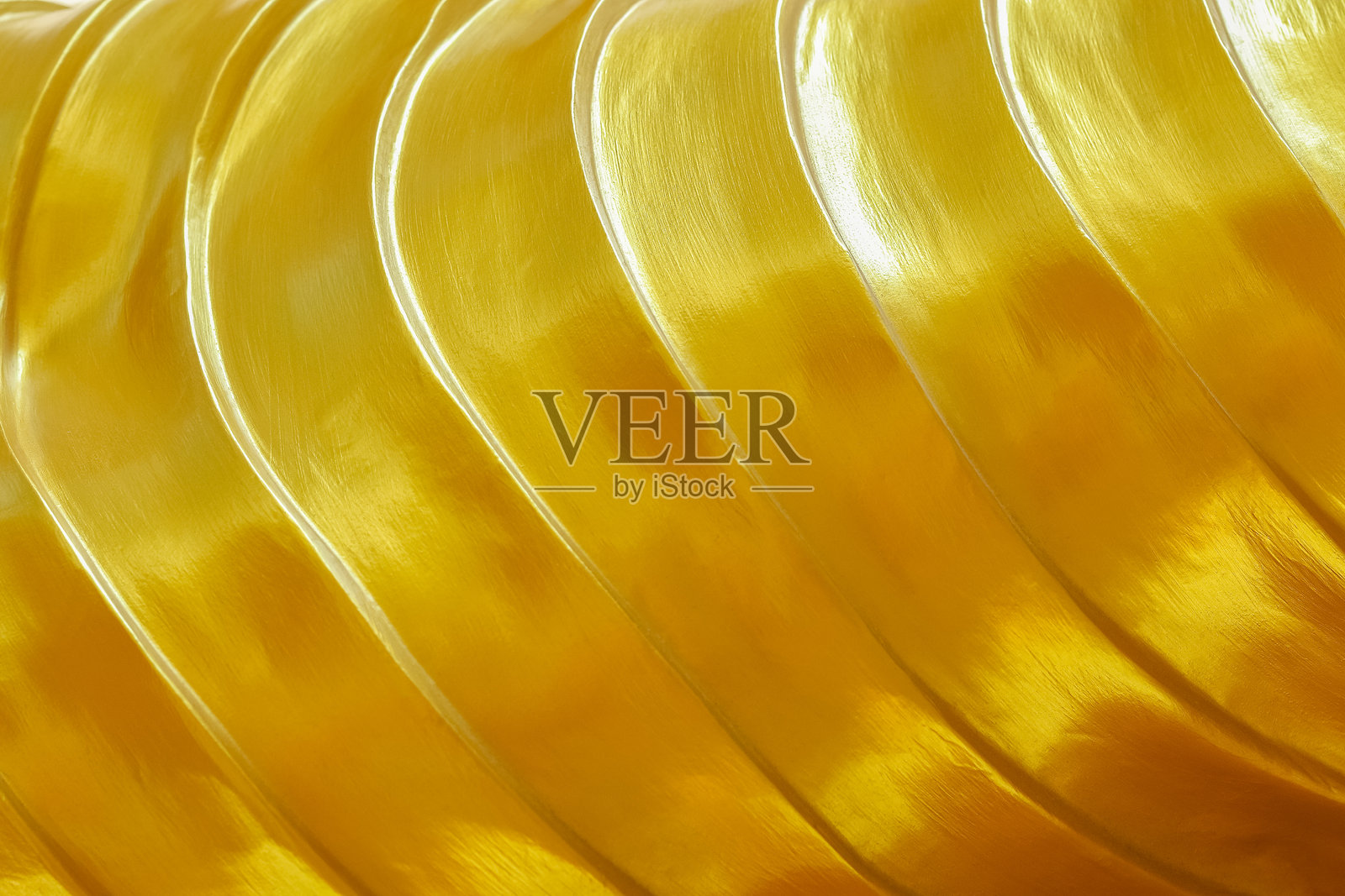 用于背景和设计的金色波浪纹理照片摄影图片