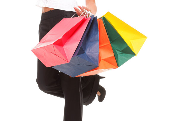 描绘快乐的女商人拿着购物袋图片下载