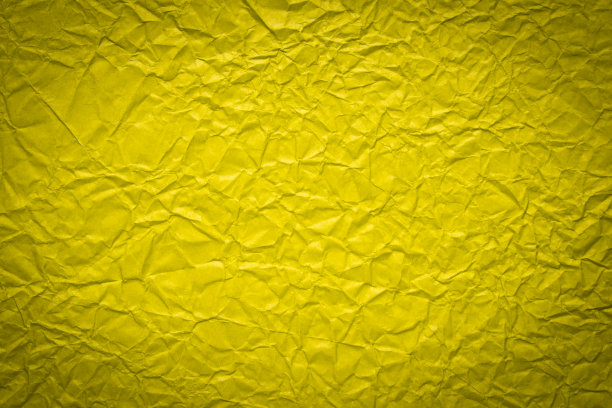 黄色皱巴巴的纸背景图片下载