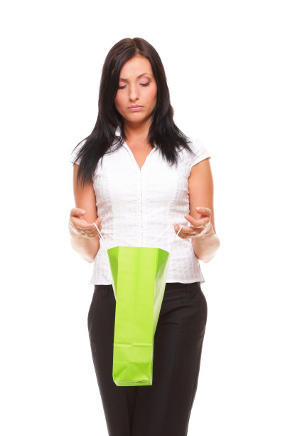 全身肖像愉快的女商人拿着购物袋图片下载