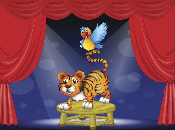 老虎和一只五颜六色的鹦鹉在舞台上表演图片下载