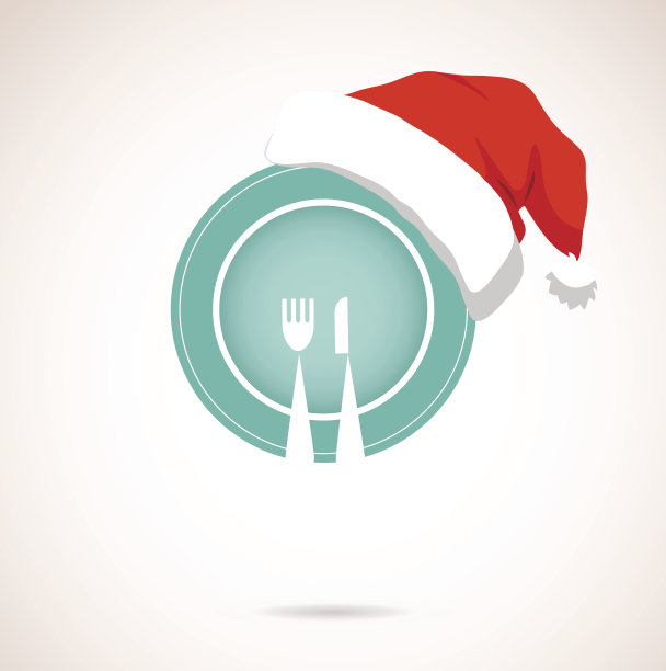 圣诞晚餐。盘子上戴着季节性的红帽子图片下载