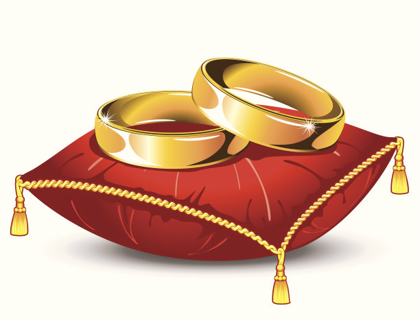 红色枕头上的结婚戒指图片下载