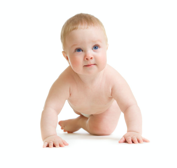 蹒跚学步的小男孩试图站起来图片下载