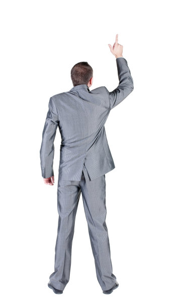 商人指着墙。后面的观点。图片下载