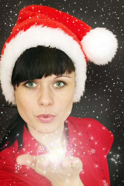 圣诞老人吹向雪花图片下载