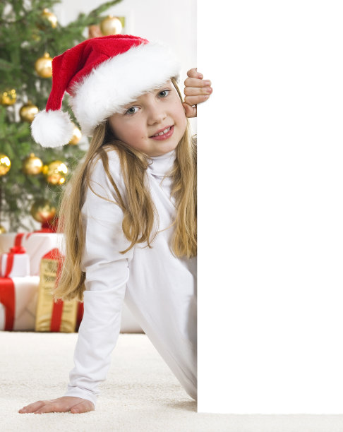 年轻的金发女孩戴着圣诞帽图片下载