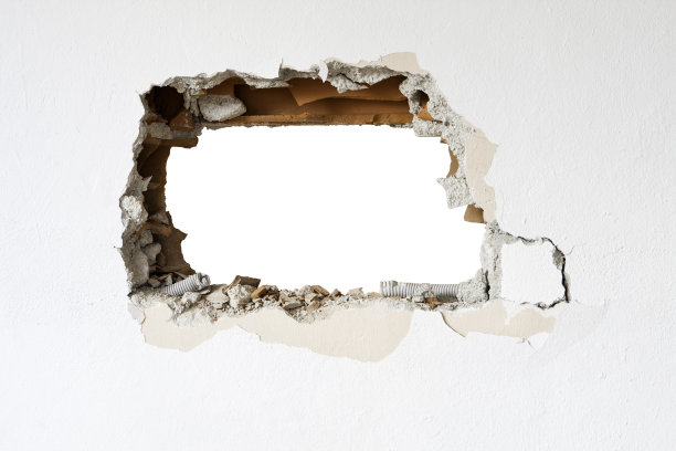 一个被白色包围的砖墙上的洞图片下载