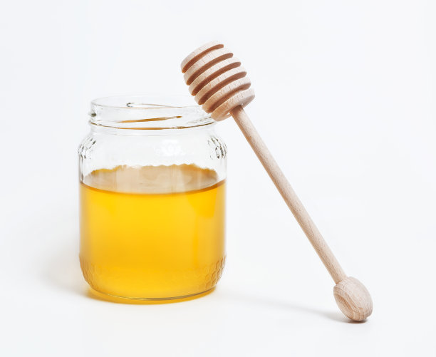 带勺子的蜂蜜罐图片下载