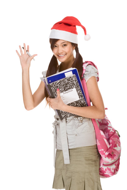 亚洲学生戴着圣诞帽向大家问好图片下载