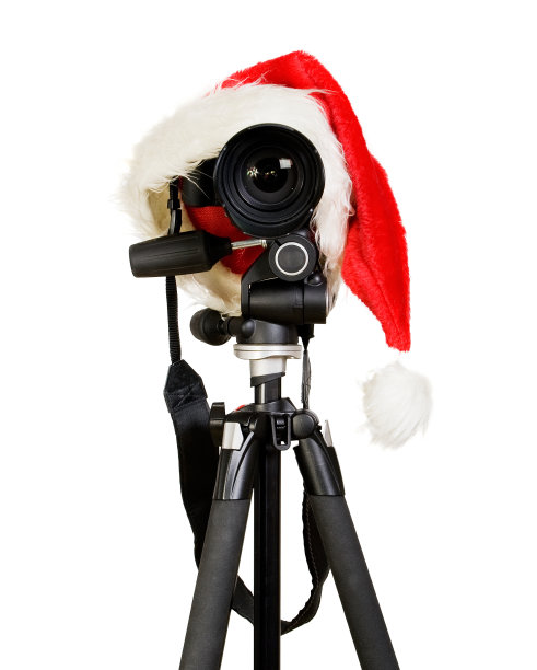 带圣诞老人帽的数码相机图片下载